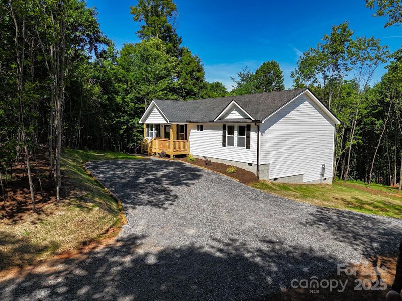Front exterior of a new home in , Candler, NC, highlighting curb appeal (Image 22).