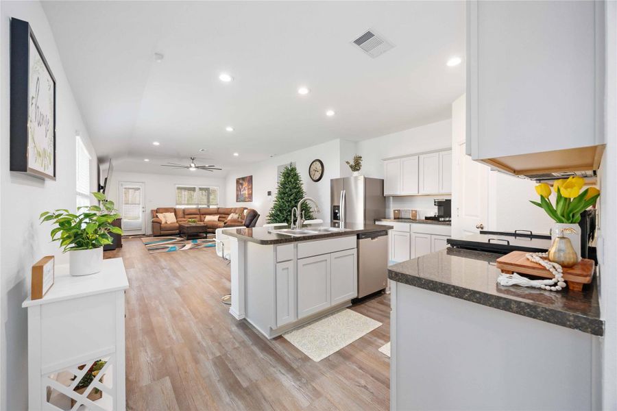 Open-Concept Kitchen & Living AreaBright, open-concept living space anchored by a spacious kitchen with a large center island, ample cabinetry, and generous counter space—perfect for everyday living and entertaining. The layout flows seamlessly into the main living area, creating a welcoming environment ideal for hosting, relaxing, or working from home. Open-Concept Kitchen & Living AreaBright, open-concept living space anchored by a spacious kitchen with a large center island, ample cabinetry, and generous counter space—perfect for everyday living and entertaining. The layout flows seamlessly into the main living area, creating a welcoming environment ideal for hosting, relaxing, or working from home.