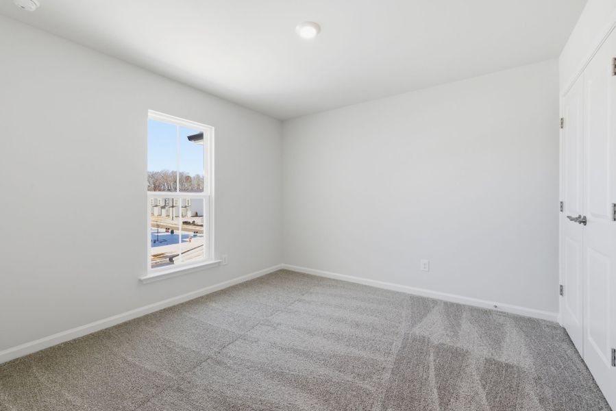 Spacious, unfurnished interior of a new home in Poets Walk, Whitsett (Image 22).