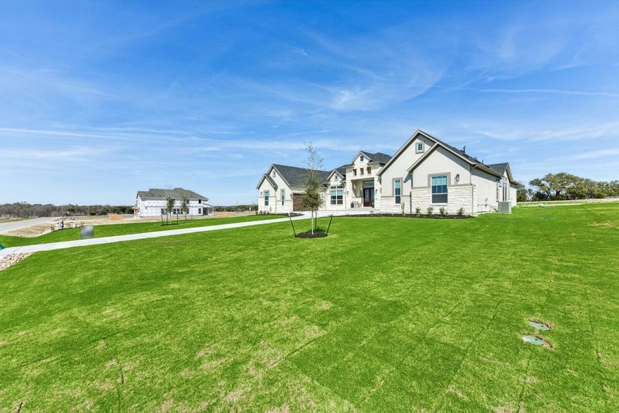 Front exterior of a new home in Feathergrass, Florence, TX, highlighting curb appeal (Image 30).