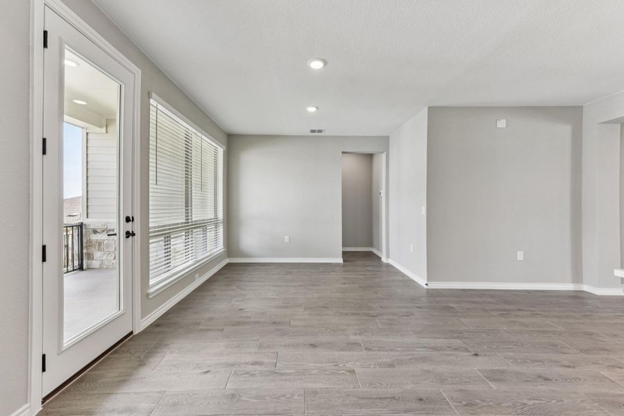 Unfurnished room with light wood finished floors and recessed lighting