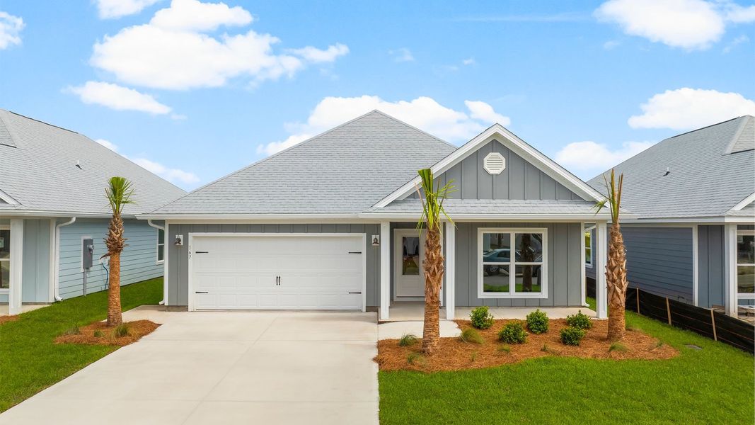 Front exterior of a new home in Windmark Beach, Port Saint Joe, FL, highlighting curb appeal (Image 1). Front exterior of a new home in Windmark Beach, Port Saint Joe, FL, highlighting curb appeal (Image 1).