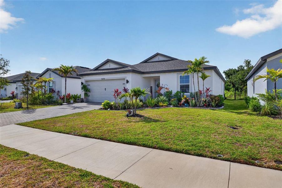 Front exterior of a new home in , Palmetto, FL, highlighting curb appeal (Image 1). Front exterior of a new home in , Palmetto, FL, highlighting curb appeal (Image 1).
