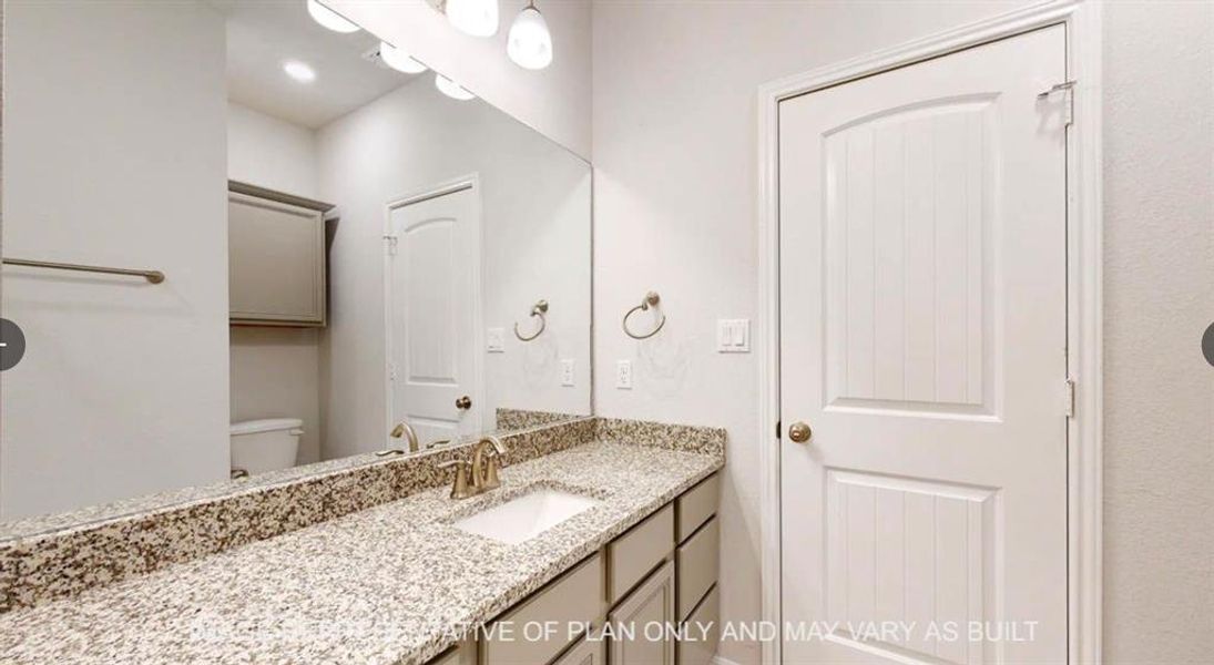 Bathroom featuring toilet and vanity Bathroom featuring toilet and vanity