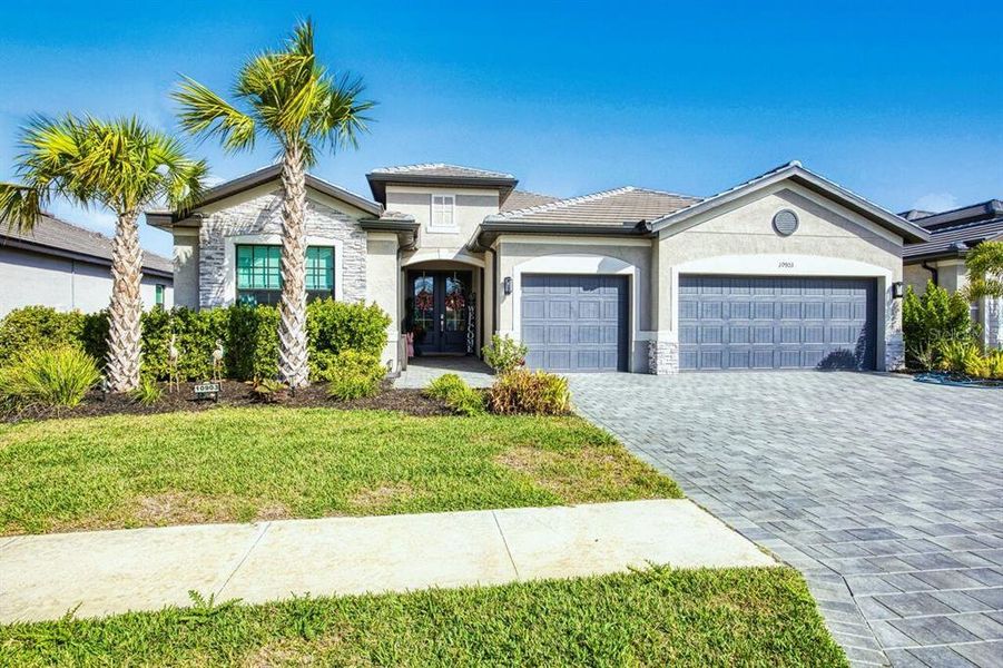 Front exterior of a new home in , Fort Myers, FL, highlighting curb appeal (Image 23).