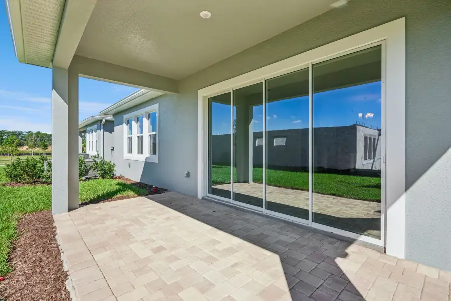 Exterior details and patio area of a home in Northlake at Ovation, Winter Garden (Image 3).