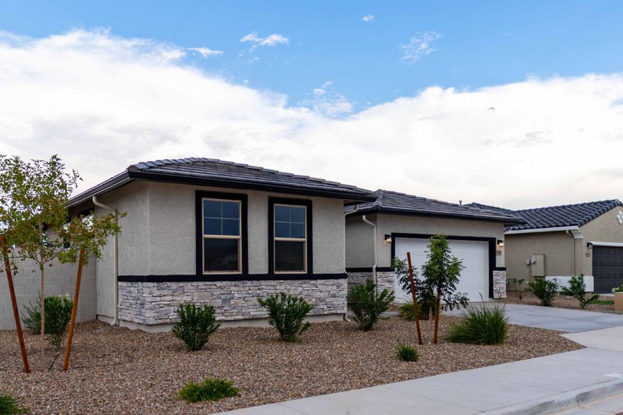 Front exterior of a new home in Rancho Mirage, Maricopa, AZ, highlighting curb appeal (Image 2). Front exterior of a new home in Rancho Mirage, Maricopa, AZ, highlighting curb appeal (Image 2).