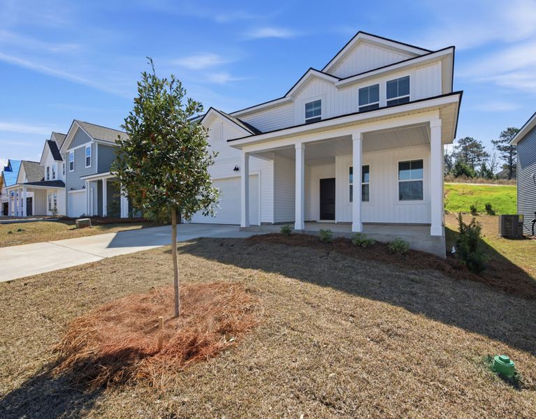 Front exterior of a new home in Grand Arbor, Blythewood, SC, highlighting curb appeal (Image 20). Front exterior of a new home in Grand Arbor, Blythewood, SC, highlighting curb appeal (Image 20).