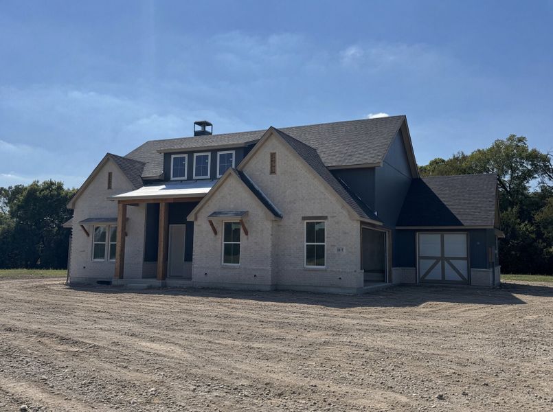 Front exterior of a new home in Cotten Creek, Azle, TX, highlighting curb appeal (Image 2).