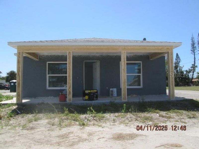 Front exterior of a new home in , Bradenton, FL, highlighting curb appeal (Image 1).