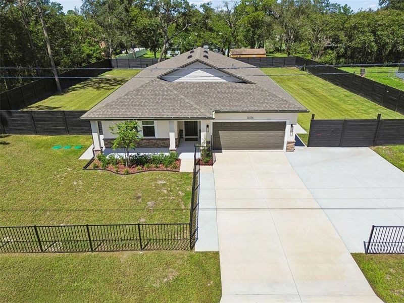 Front exterior of a new home in , Spring Hill, FL, highlighting curb appeal (Image 28).