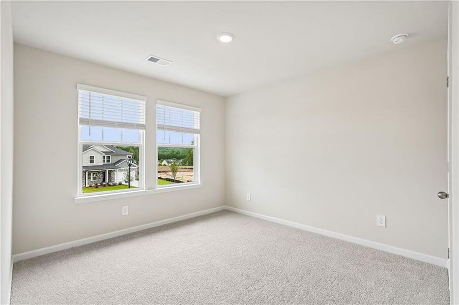 Spacious, unfurnished interior of a new home in Northwoods at Mirror Lake, Villa Rica (Image 59).