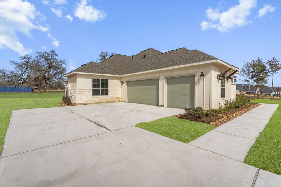 Front exterior of a new home in Chapel Bend, Montgomery, TX, highlighting curb appeal (Image 2). Front exterior of a new home in Chapel Bend, Montgomery, TX, highlighting curb appeal (Image 2).