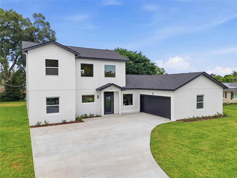 Front exterior of a new home in , Longwood, FL, highlighting curb appeal (Image 1). Front exterior of a new home in , Longwood, FL, highlighting curb appeal (Image 1).
