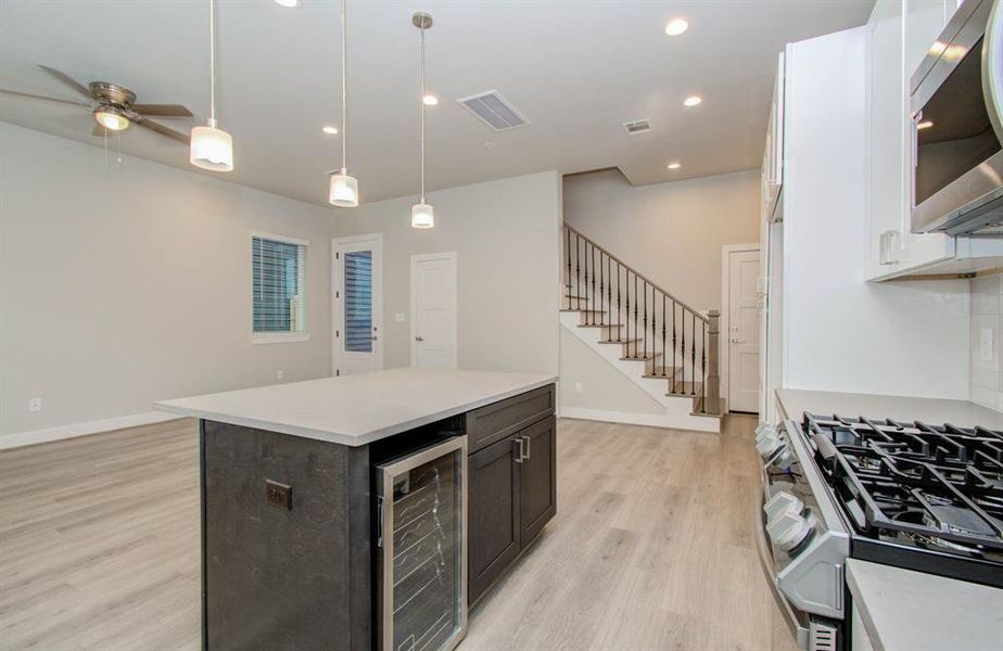 The kitchen comes with a wine cooler. (Transitional finishes shown).