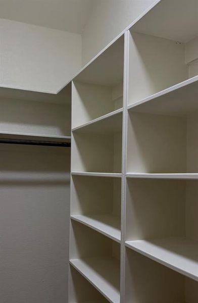 Buy all the shoes you want, you have room in this primary closet for everything!