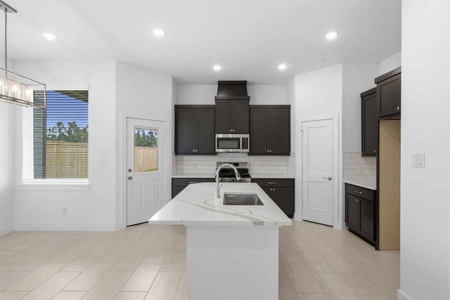 Furnished interior view inside a new home in Bridgeland, Cypress (Image 11).