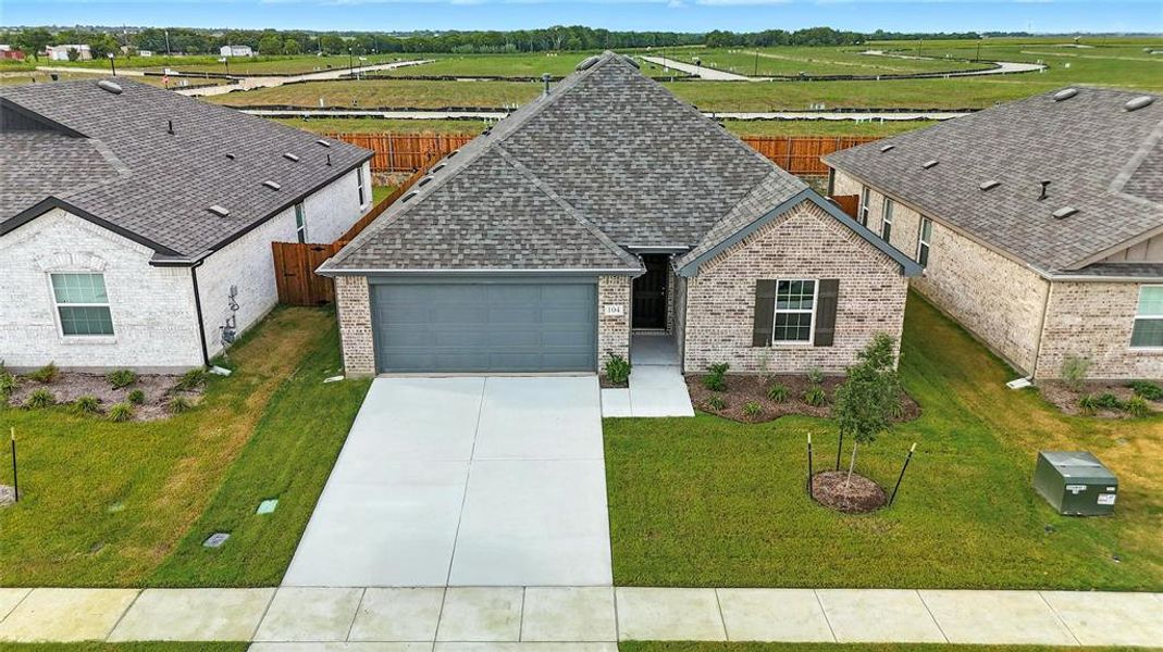 View of front of house featuring brick siding, roof with shingles, concrete driveway, and a garage View of front of house featuring brick siding, roof with shingles, concrete driveway, and a garage