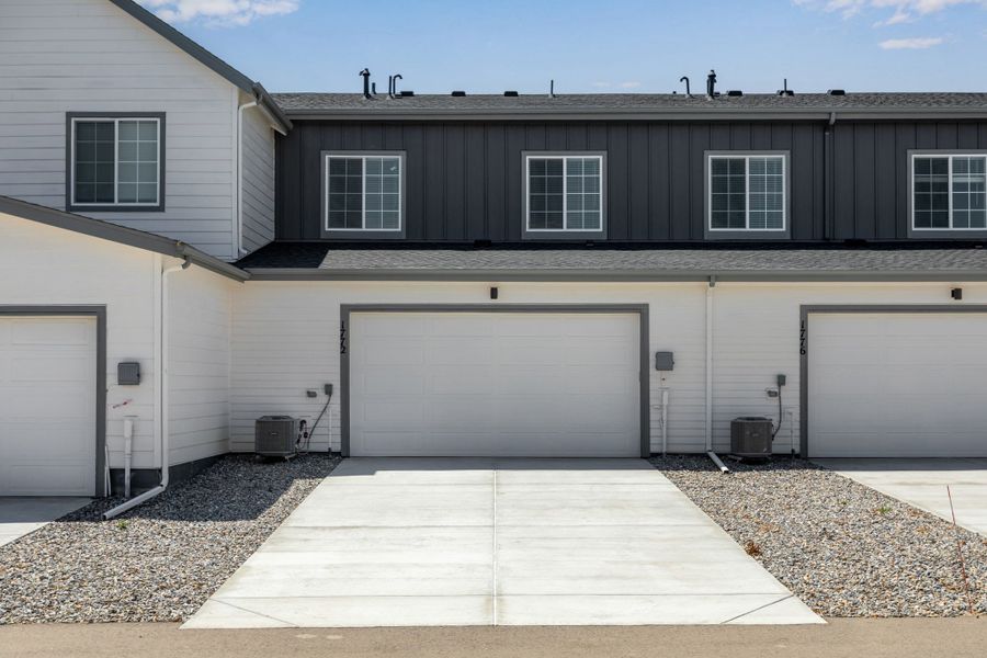 Front exterior of a new home in Westside Crossing, Berthoud, CO, highlighting curb appeal (Image 20).