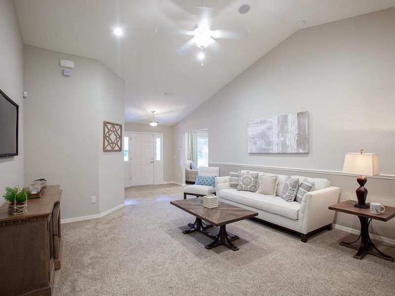 Bright and open gathering room with volume ceiling - Ryleigh home plan by Highland Homes