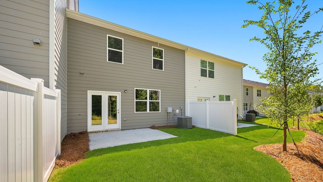 Exterior details and patio area of a home in Independence Villas and Townhomes, Loganville (Image 3).