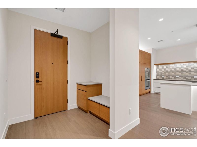 This entryway is very functional, with a drop zone, huge closet and a tucked-away powder bath.