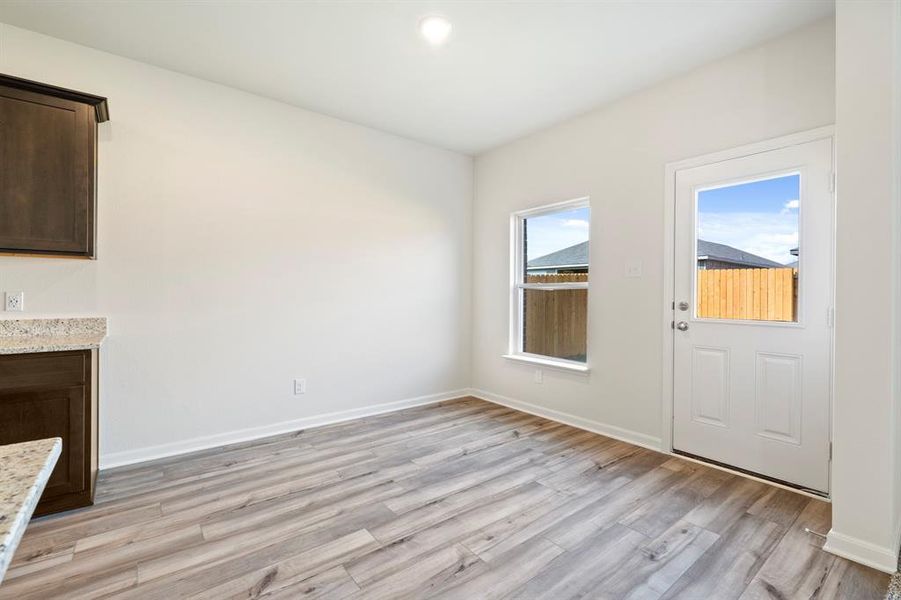 Unfurnished living room featuring light hardwood / wood-style floors