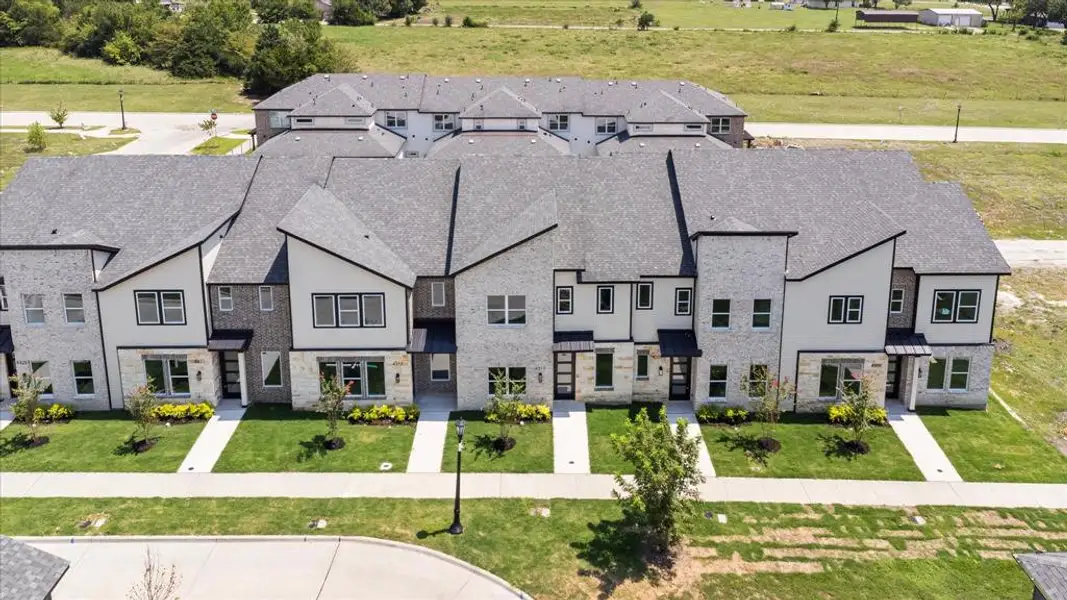 Front exterior of a new home in , Rowlett, TX, highlighting curb appeal (Image 2).