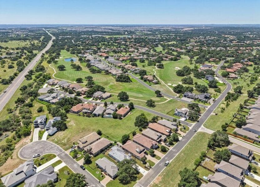 Front exterior of a new home in Cimarron Hills – Villas & Country Club, Georgetown, TX, highlighting curb appeal (Image 54).
