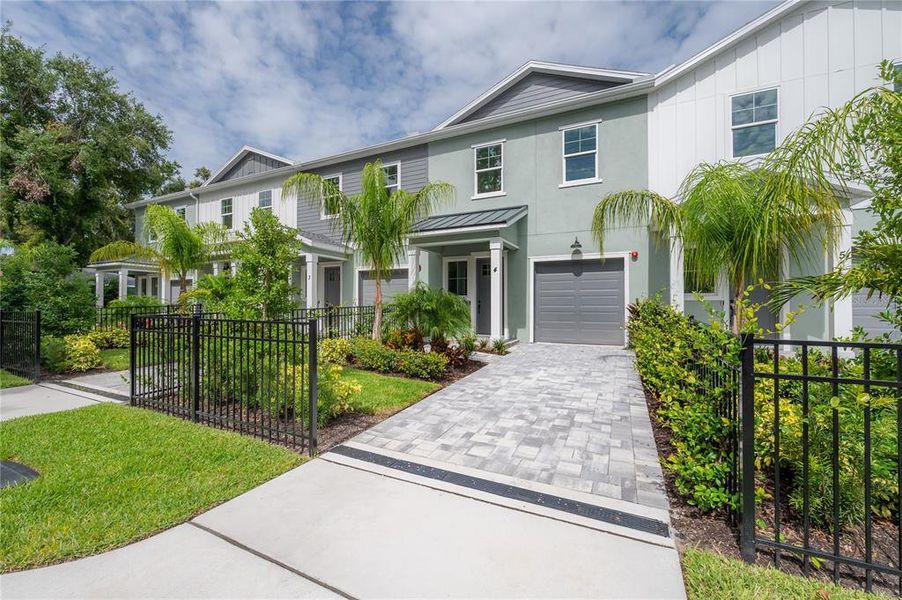 Front exterior of a new home in , Tampa, FL, highlighting curb appeal (Image 25).