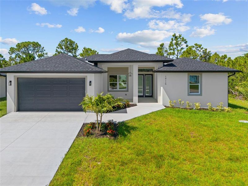 Front exterior of a new home in , Port Charlotte, FL, highlighting curb appeal (Image 1).