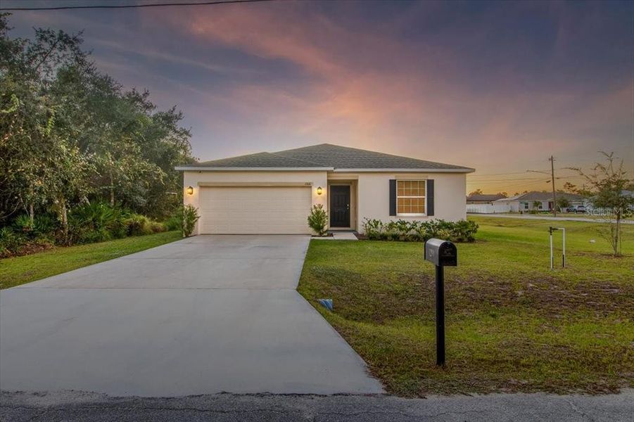 Front exterior of a new home in Poinciana, Poinciana, FL, highlighting curb appeal (Image 21).
