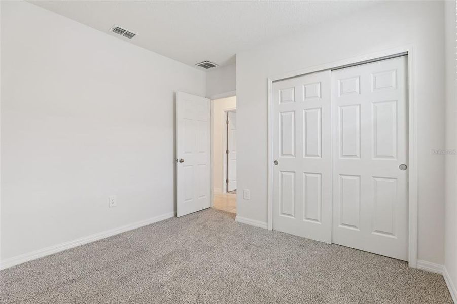 Spacious, unfurnished interior of a new home in Lawson Dunes - Signature Series, Haines City (Image 19).