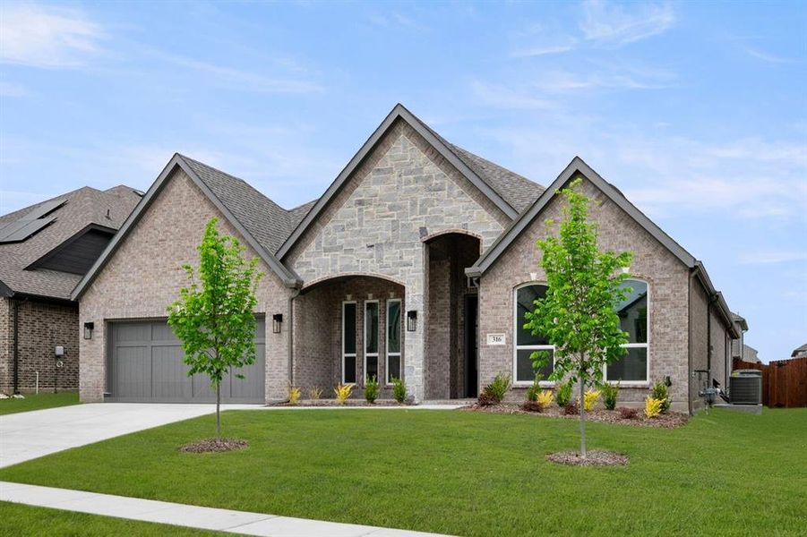 Front exterior of a new home in High Country, Burleson, TX, highlighting curb appeal (Image 2).
