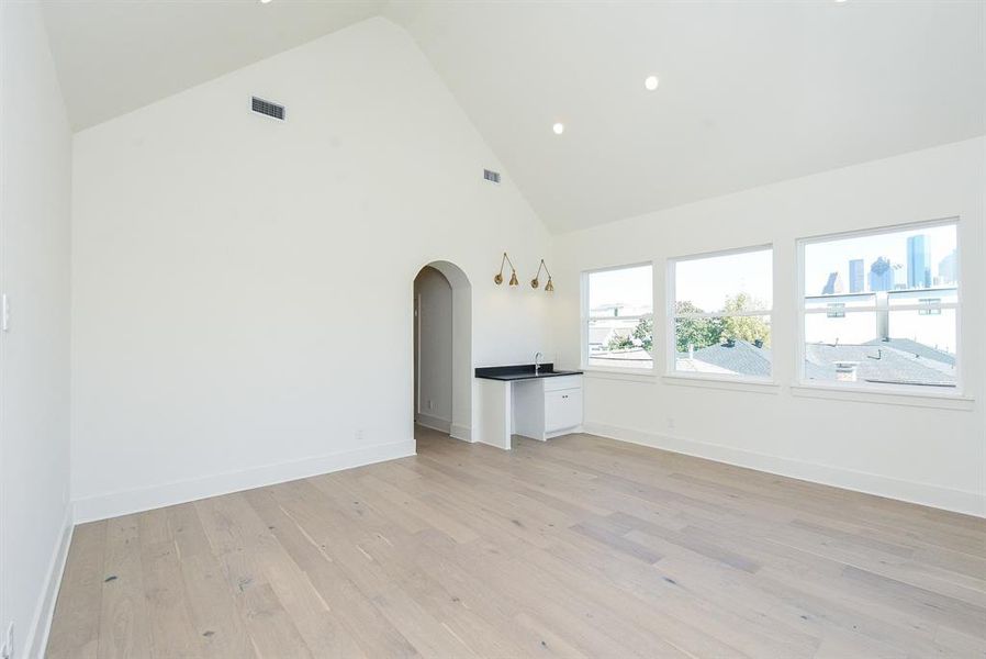 Third floor game room with wet bar.