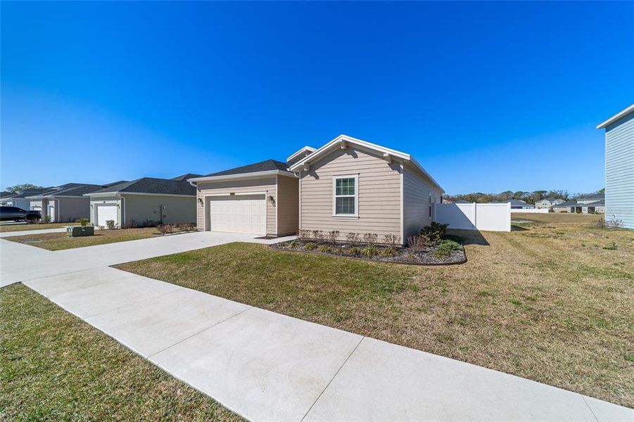 Front exterior of a new home in Millwood, Ocala, FL, highlighting curb appeal (Image 31).
