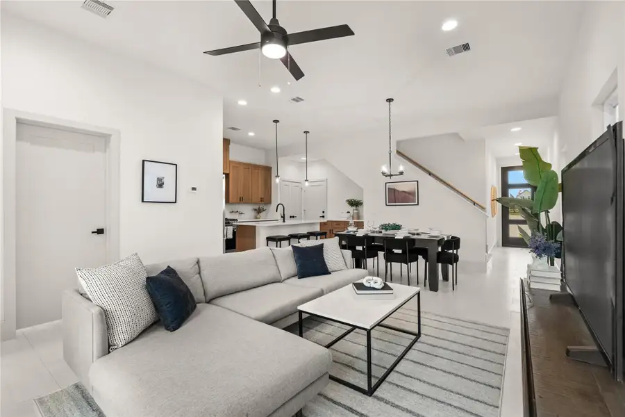 Great room feel — living and kitchen open to one another with high ceilings Great room feel — living and kitchen open to one another with high ceilings