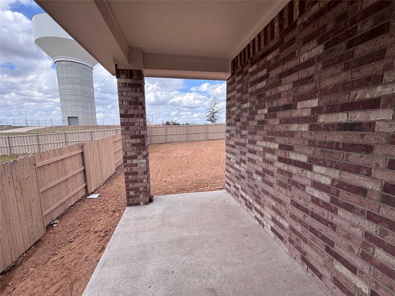 Exterior details and patio area of a home in The Colony, Bastrop (Image 11).