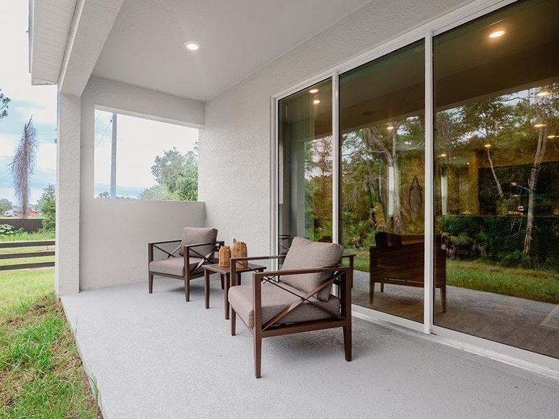 Your interior opens to outdoor living space on a large covered lanai - Birch townhome by Highland Homes Your interior opens to outdoor living space on a large covered lanai - Birch townhome by Highland Homes
