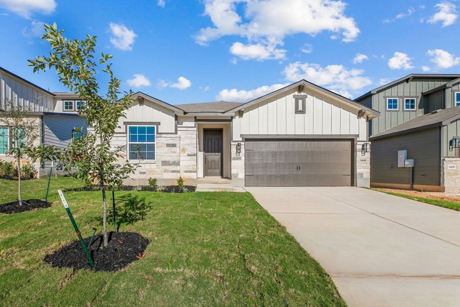 Representative exterior photo of a completed home built from the Arlington by Hakes Brothers in Hickory Ridge, Elmendorf, TX (Image 1). Representative exterior photo of a completed home built from the Arlington by Hakes Brothers in Hickory Ridge, Elmendorf, TX (Image 1).