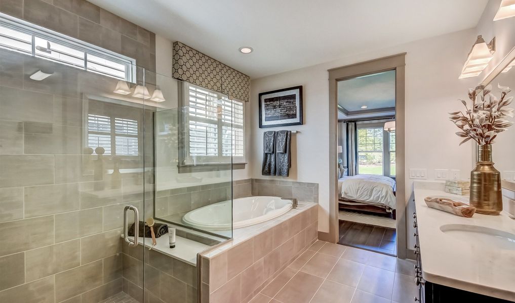 Owner's bath with tub and shower