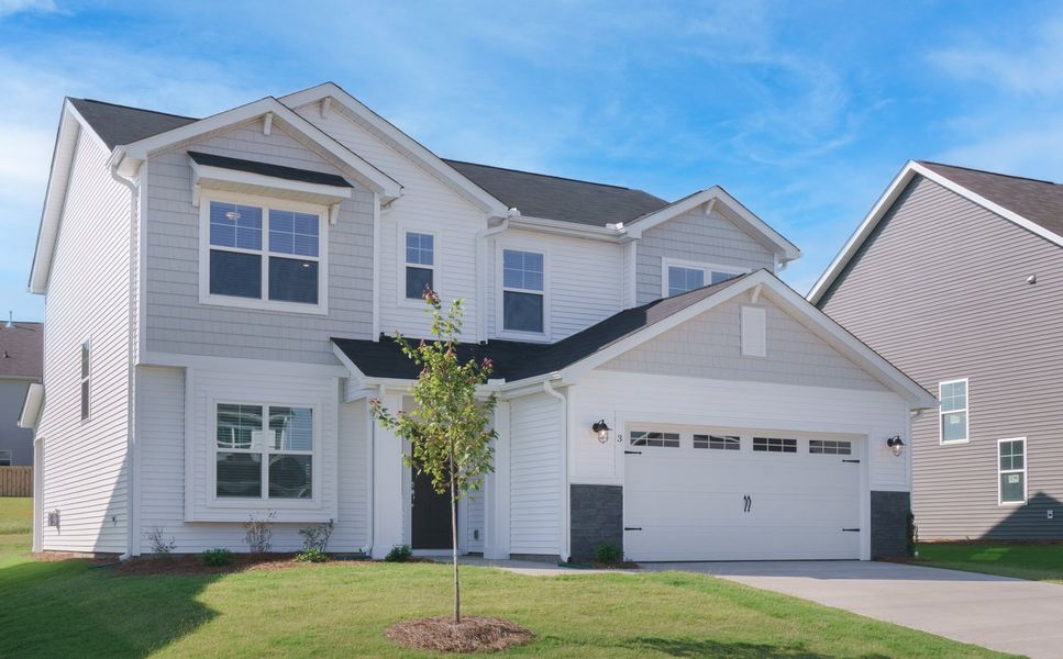 Representative exterior photo of a completed home built from the The Calle by Cothran Homes in Holly Ridge, Greenville, SC (Image 21). Representative exterior photo of a completed home built from the The Calle by Cothran Homes in Holly Ridge, Greenville, SC (Image 21).