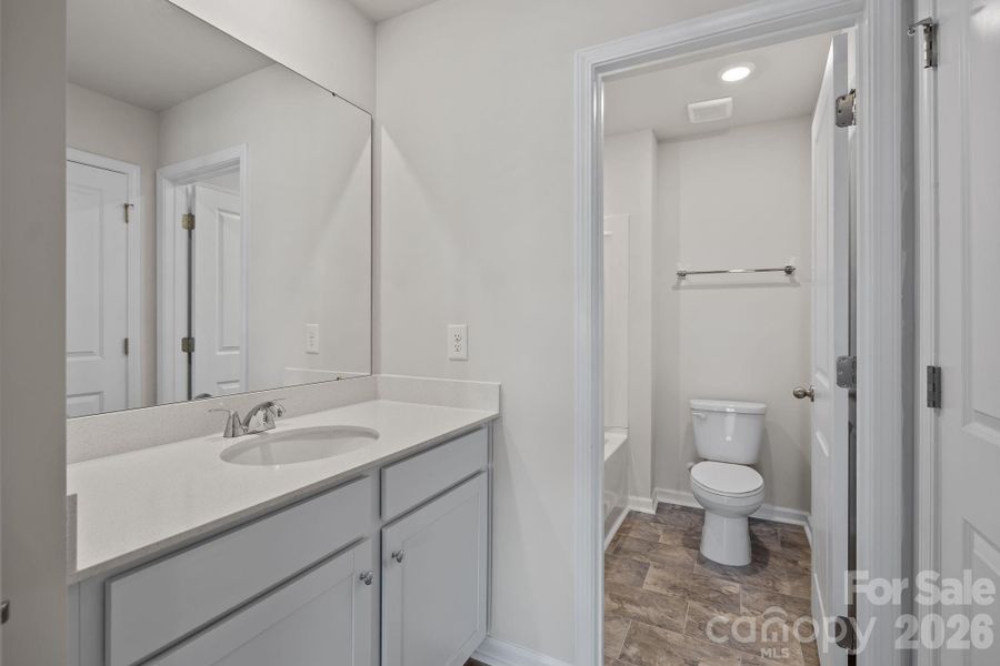 Furnished interior view inside a new home in McFarland Estates, York (Image 12).