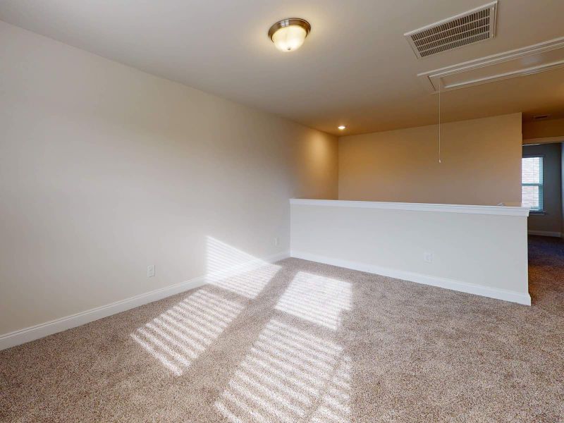 A large loft gives the kids a place to hang out with friends. A large loft gives the kids a place to hang out with friends.