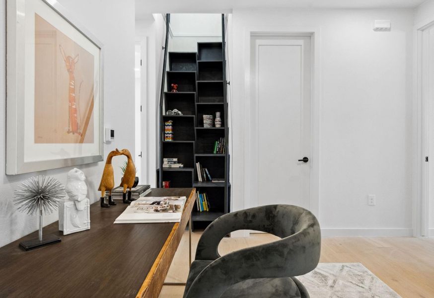 Built-in attic staircase with storage and shelves