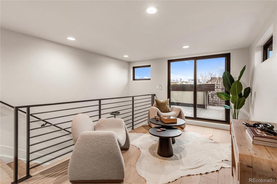 Wet bar and top floor lounge that opens to the roof deck