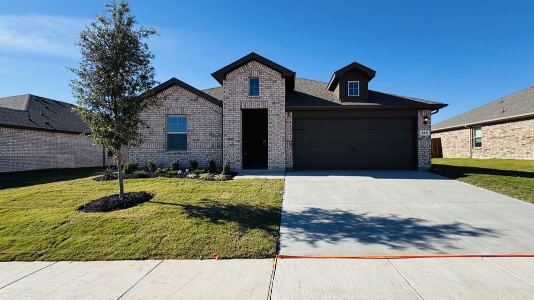 Representative exterior photo of a completed home built from the justin by D.R. Horton in Hickory Grove, Krum, TX (Image 1).