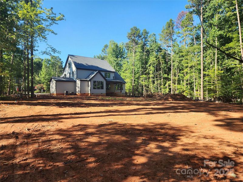 Front exterior of a new home in , Matthews, NC, highlighting curb appeal (Image 27).