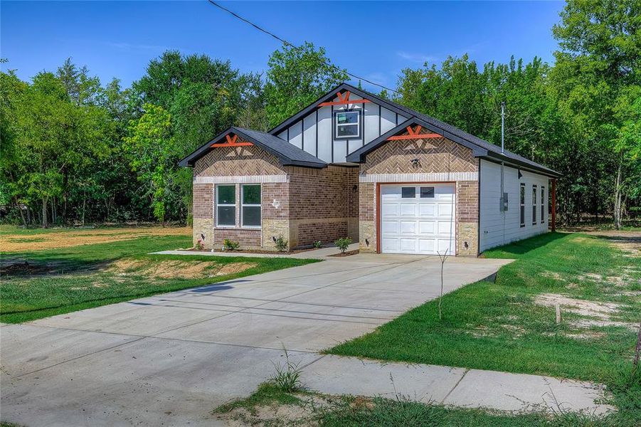 Front exterior of a new home in , Greenville, TX, highlighting curb appeal (Image 21). Front exterior of a new home in , Greenville, TX, highlighting curb appeal (Image 21).