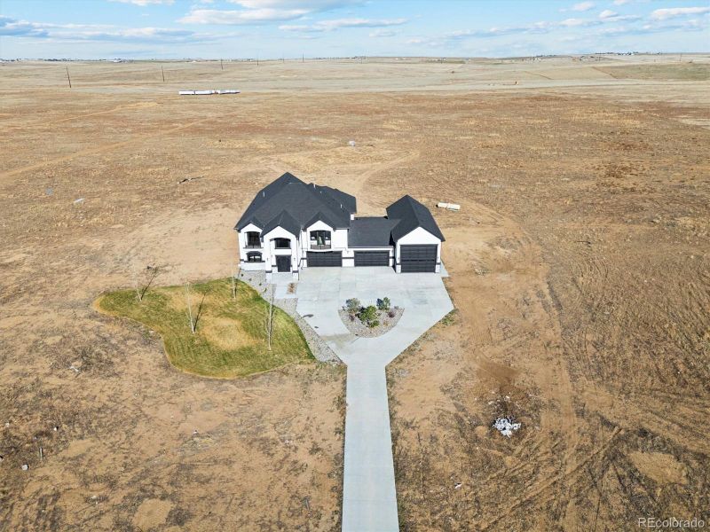 Front exterior of a new home in , Hudson, CO, highlighting curb appeal (Image 26).